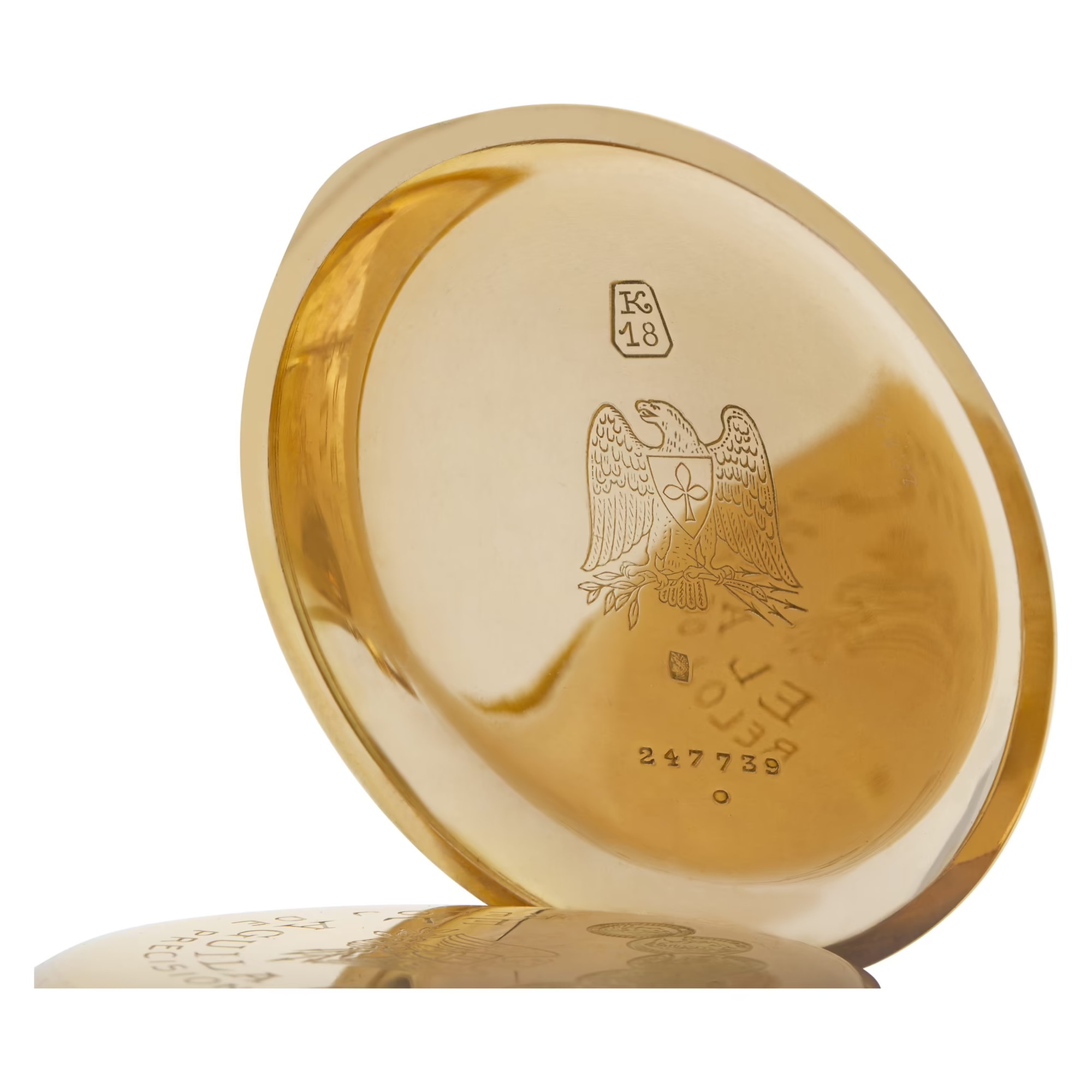 The El Aguila eagle engraved inside the gold case of a pocket watch